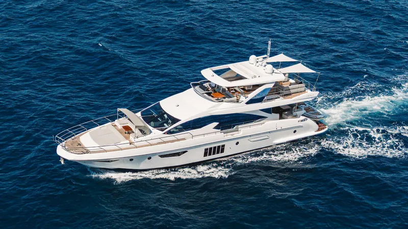 April Fools Yacht Photos Pics 2018 Azimut 80 Flybridge yacht cruising on open blue sea.