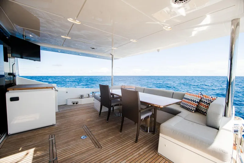 April Fools Yacht Photos Pics Luxurious 2018 Azimut 80 Flybridge yacht deck with ocean view and elegant seating area.