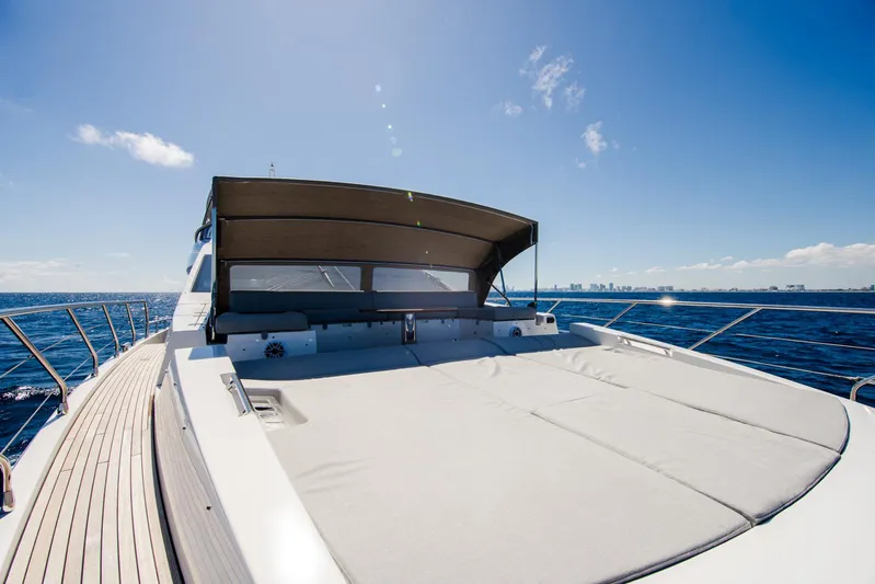 April Fools Yacht Photos Pics Azimut 80 Flybridge 2018 yacht with sun deck, cruising on open sea under clear blue sky.