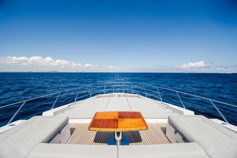 April Fools Yacht Photos Pics Azimut 80 Flybridge 2018 yacht deck with ocean view, featuring seating and table.