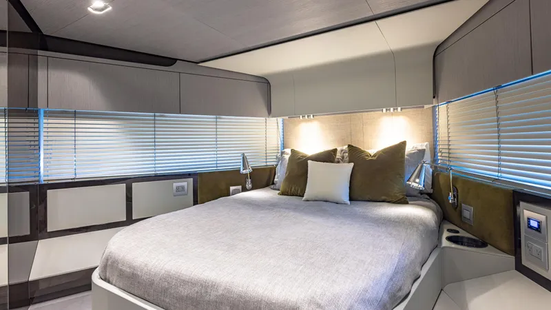 April Fools Yacht Photos Pics Luxurious bedroom interior of 2018 Azimut 80 Flybridge yacht with modern design and cozy bedding.