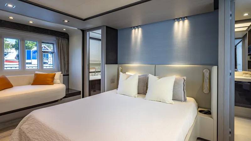 April Fools Yacht Photos Pics Luxurious bedroom interior of 2018 Azimut 80 Flybridge yacht with modern decor.