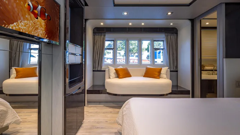 April Fools Yacht Photos Pics Luxurious interior of 2018 Azimut 80 Flybridge yacht with elegant seating and modern decor.