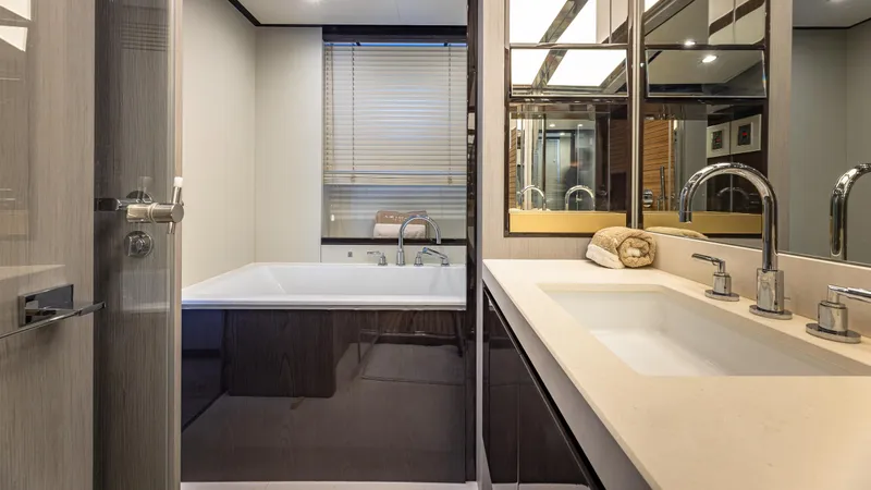 April Fools Yacht Photos Pics Luxurious bathroom in 2018 Azimut 80 Flybridge yacht with modern fixtures and elegant design.