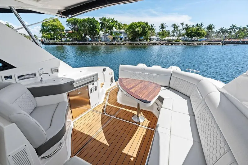 Maxsea Yacht Photos Pics Luxurious 2022 Sea Ray Sundancer 320 Outboard yacht interior with elegant seating and scenic water view.