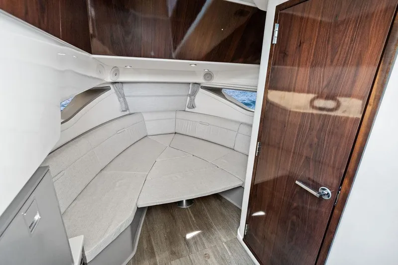 Maxsea Yacht Photos Pics Interior cabin of 2022 Sea Ray Sundancer 320 Outboard with wood accents and seating.