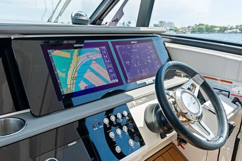 Maxsea Yacht Photos Pics 2022 Sea Ray Sundancer 320 Outboard helm with Simrad navigation displays and steering wheel.