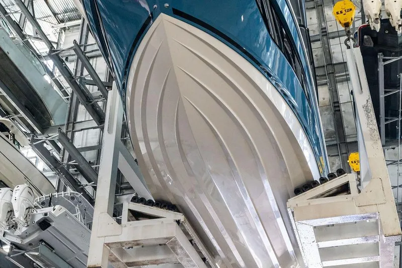 Maxsea Yacht Photos Pics 2022 Sea Ray Sundancer 320 Outboard in a boat storage facility, viewed from below.
