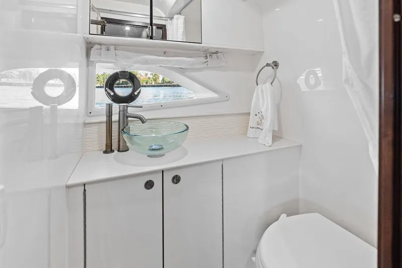 Maxsea Yacht Photos Pics Luxurious bathroom in 2022 Sea Ray Sundancer 320 Outboard with glass sink and modern fixtures.