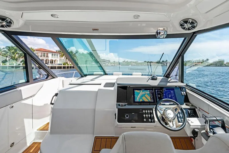 Maxsea Yacht Photos Pics 2022 Sea Ray Sundancer 320 Outboard helm with modern navigation displays and waterfront view.