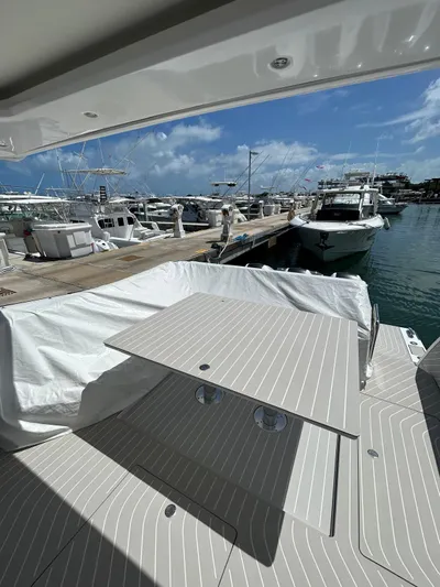 No Name Yacht Photos Pics 2024 Azimut Verve 48 yacht docked at marina with table setup.