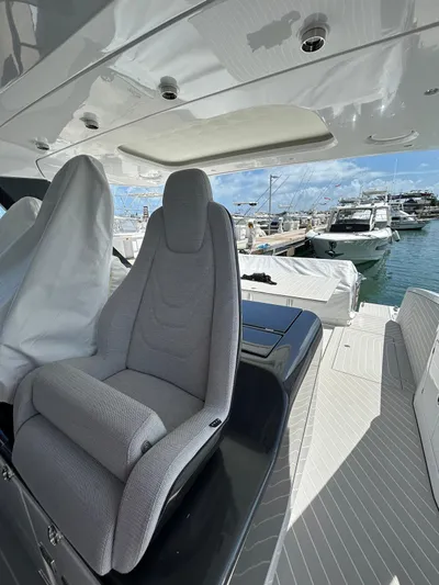 No Name Yacht Photos Pics 2024 Azimut Verve 48 yacht interior with plush seating and marina view.