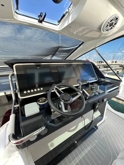 No Name Yacht Photos Pics 2024 Azimut Verve 48 helm with modern navigation controls and sleek design.