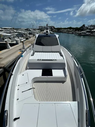 No Name Yacht Photos Pics 2024 Azimut Verve 48 yacht docked in a marina under a partly cloudy sky.
