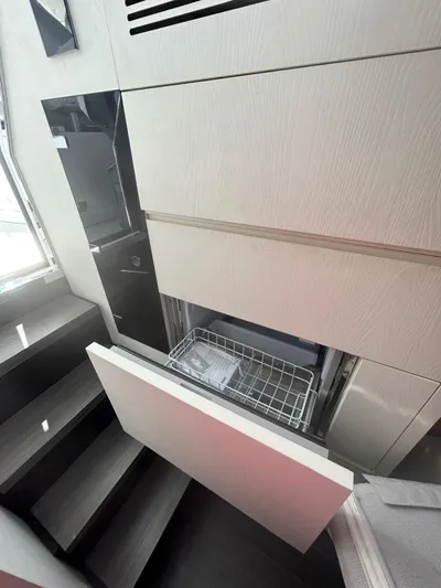 No Name Yacht Photos Pics 2024 Azimut Verve 48 yacht interior with built-in dishwasher and modern cabinetry.