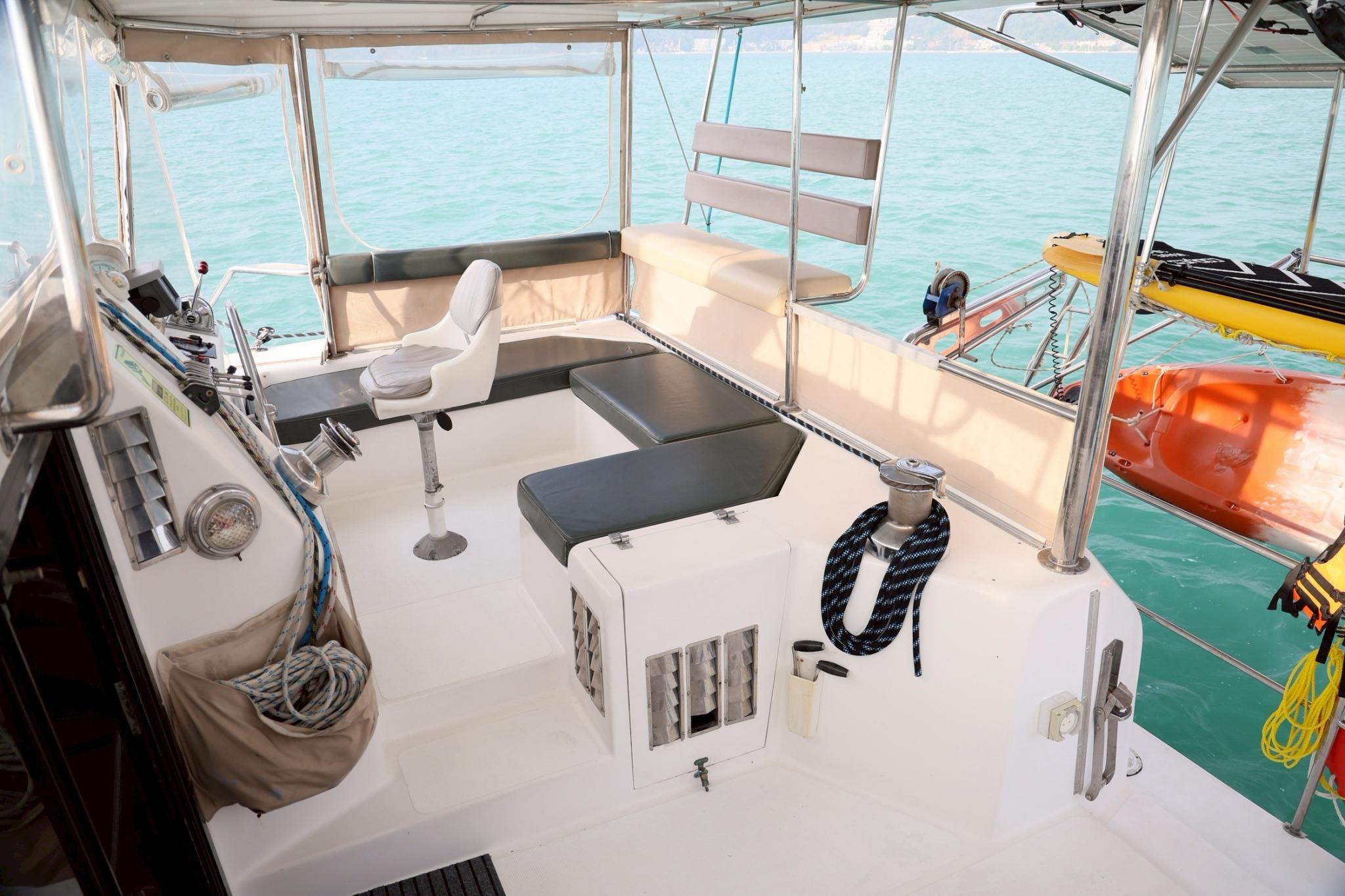 Spacious cockpit of 2001 IMP 55 yacht with seating and ocean view.