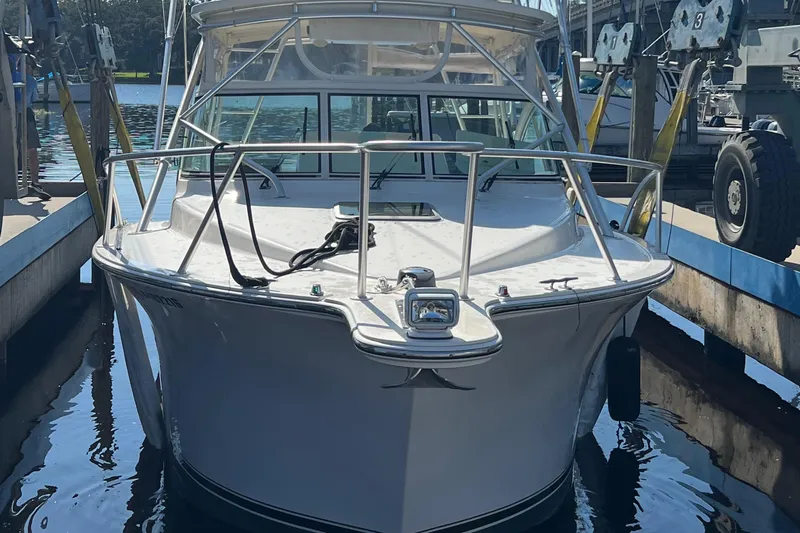  Yacht Photos Pics 2004 Albemarle 310 Express Fisherman boat docked in marina.