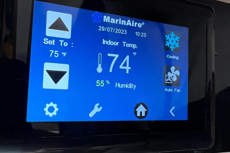  Yacht Photos Pics Touchscreen displaying MarinAire settings: temperature 74°F, humidity 55%, cooling mode active.