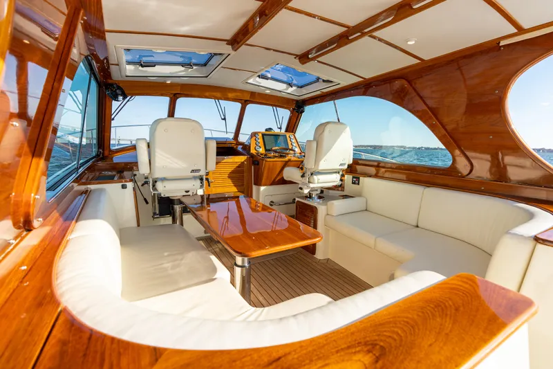 Upshort Yacht Photos Pics Luxurious interior of 2010 Hinckley Talaria 44 MKII Express yacht with elegant wood finish.