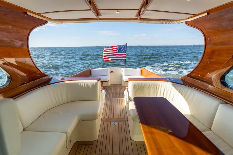 Upshort Yacht Photos Pics Hinckley Talaria 44 MKII Express yacht interior with ocean view and American flag, 2010 model.