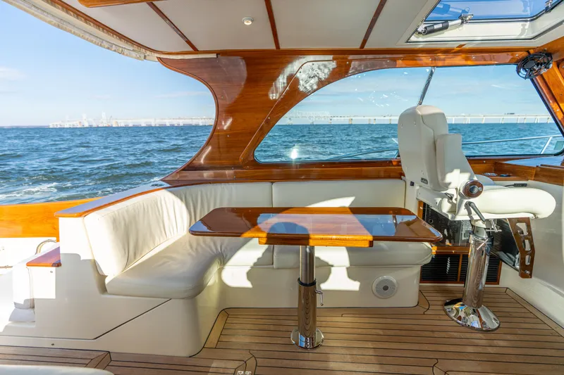 Upshort Yacht Photos Pics Luxurious interior of 2010 Hinckley Talaria 44 MKII Express yacht with ocean view.