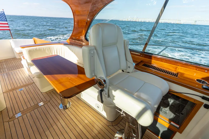 Upshort Yacht Photos Pics Luxurious 2010 Hinckley Talaria 44 MKII Express yacht interior with leather seating and wooden accents.