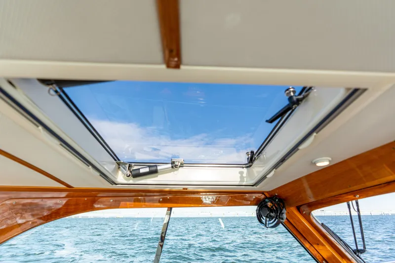 Upshort Yacht Photos Pics Interior view of 2010 Hinckley Talaria 44 MKII Express yacht with skylight and ocean backdrop.