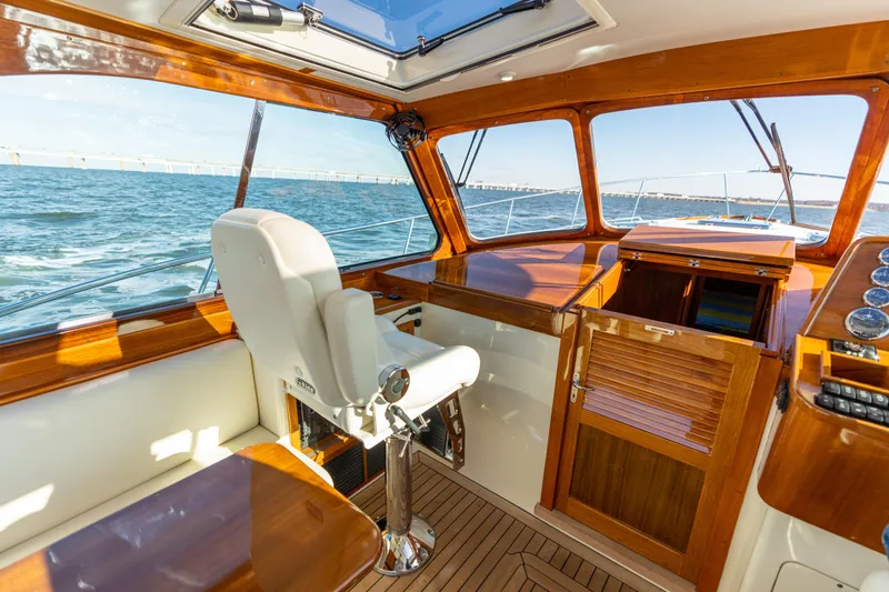 Upshort Yacht Photos Pics Interior of 2010 Hinckley Talaria 44 MKII Express yacht with wooden finishes and ocean view.