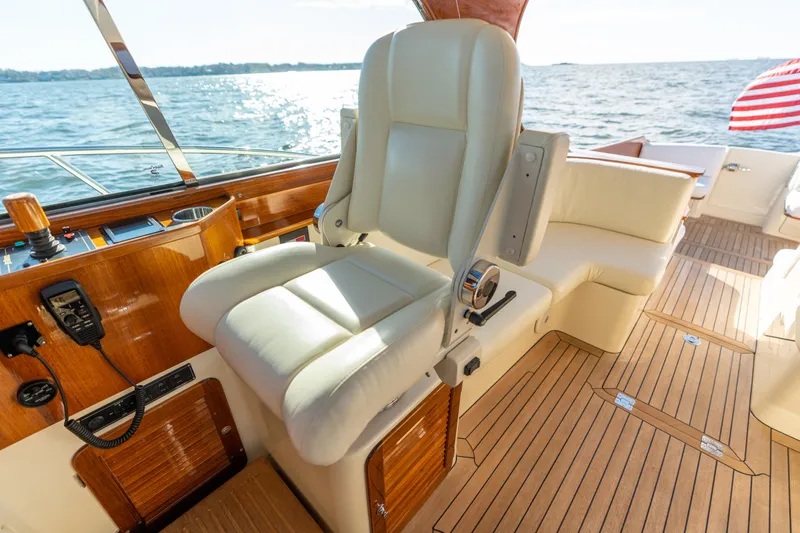 Upshort Yacht Photos Pics Luxury helm seat on 2010 Hinckley Talaria 44 MKII Express yacht, overlooking ocean.