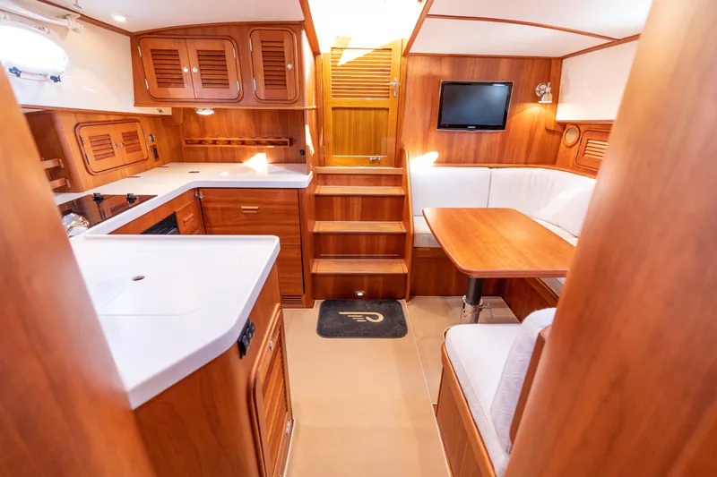 Upshort Yacht Photos Pics Luxurious interior of 2010 Hinckley Talaria 44 MKII Express yacht with wood finish.