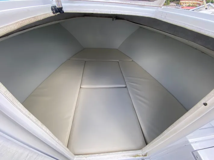 Swell Chaser Yacht Photos Pics Interior of a 2005 Contender 31 boat with cushioned seating.