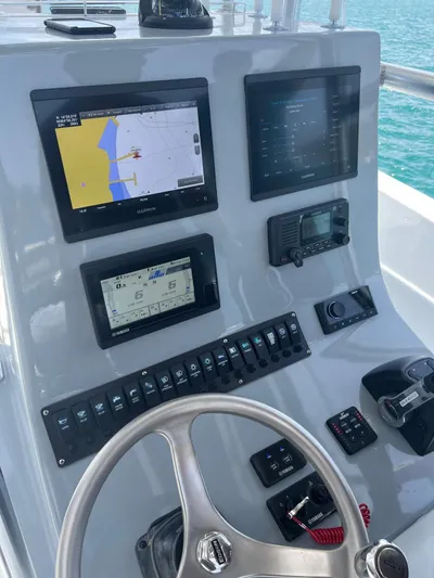 Swell Chaser Yacht Photos Pics 2005 Contender 31 boat helm with Garmin displays.