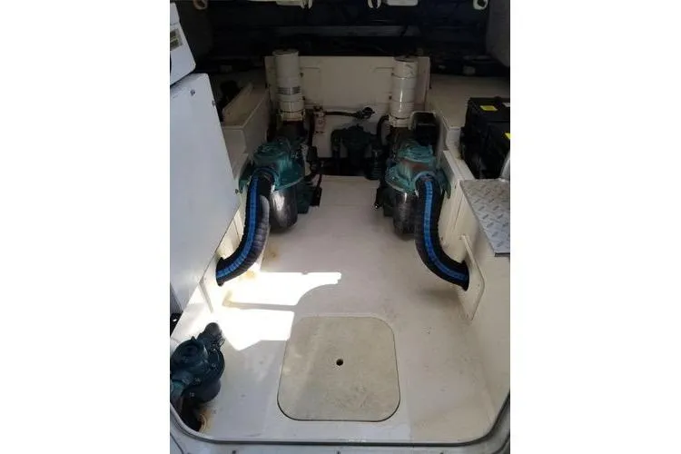 Yacht Photos Pics Engine room of 2005 Luhrs 41 Convertible boat, showcasing dual engines and components.