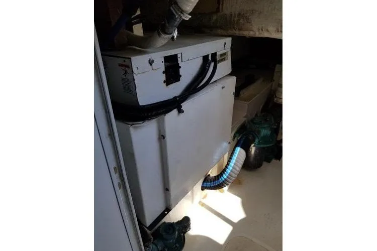  Yacht Photos Pics Engine room of 2005 Luhrs 41 Convertible boat with visible machinery and piping.