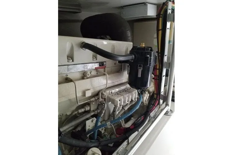  Yacht Photos Pics Engine compartment of a 2005 Luhrs 41 Convertible boat, showcasing detailed components.