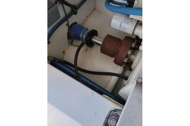  Yacht Photos Pics Engine compartment of 2005 Luhrs 41 Convertible boat, showing mechanical components and hoses.