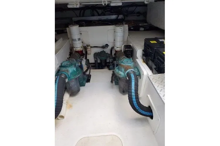  Yacht Photos Pics Engine room of 2005 Luhrs 41 Convertible boat, featuring dual engines and equipment.