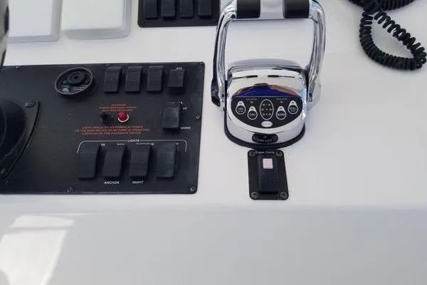  Yacht Photos Pics Control panel of a 2005 Luhrs 41 Convertible boat with throttle and switches.