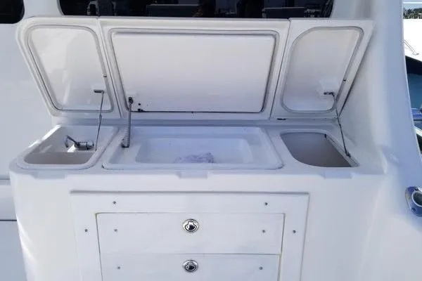  Yacht Photos Pics 2005 Luhrs 41 Convertible yacht sink and storage area with open compartments.