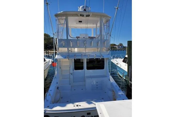  Yacht Photos Pics 2005 Luhrs 41 Convertible yacht docked, featuring spacious deck and flybridge.
