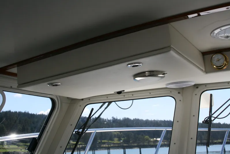 Gypsy Spirit Yacht Photos Pics Interior view of 2011 Ocean Sport Roamer 30' boat with windows and ceiling details.