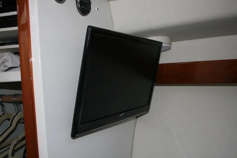 Gypsy Spirit Yacht Photos Pics Flat-screen TV mounted inside 2011 Ocean Sport Roamer 30' boat cabin.