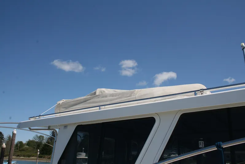 Gypsy Spirit Yacht Photos Pics Ocean Sport Roamer 30' 2011 boat roof against clear blue sky.