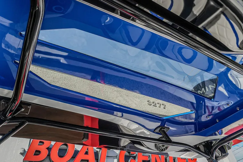  Yacht Photos Pics 2024 Renegade 38 Open boat, blue hull, displayed at a boat center.