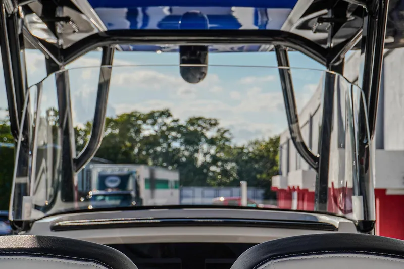  Yacht Photos Pics 2024 Renegade 38 Open boat interior view with clear windshield and outdoor background.