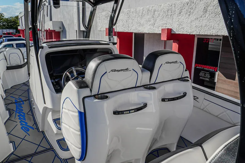  Yacht Photos Pics 2024 Renegade 38 Open boat interior with sleek seating and modern dashboard design.