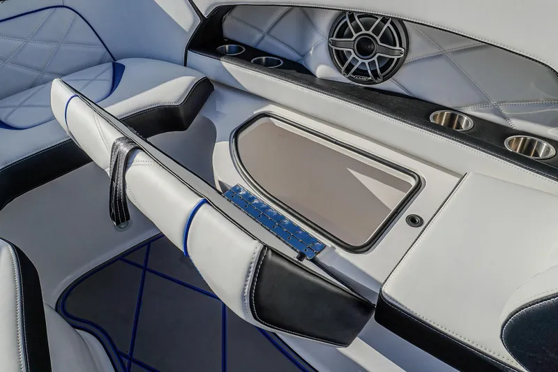  Yacht Photos Pics 2024 Renegade 38 Open boat interior with luxury seating and built-in speaker system.