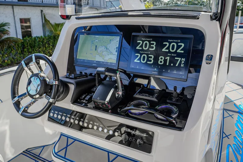  Yacht Photos Pics 2024 Renegade 38 Open boat dashboard with navigation screens and controls.