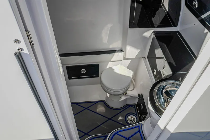  Yacht Photos Pics 2024 Renegade 38 Open boat interior bathroom with modern fixtures and sleek design.