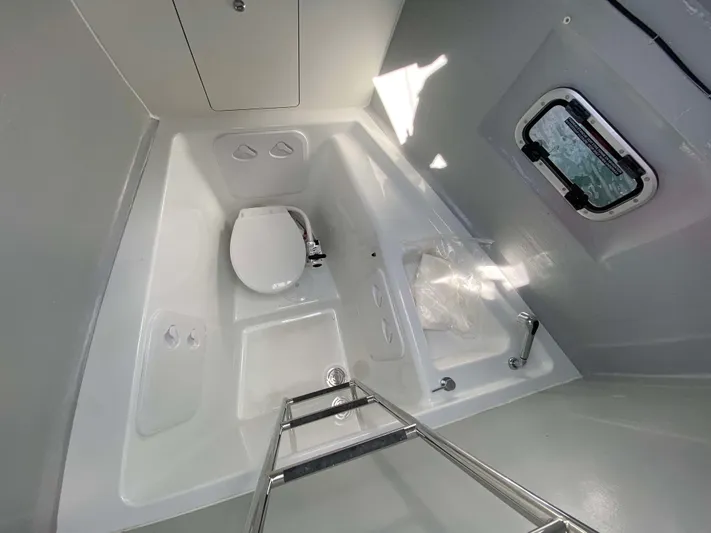  Yacht Photos Pics Bathroom interior of 2025 Lagoon 46 yacht, featuring modern fixtures and a compact design.